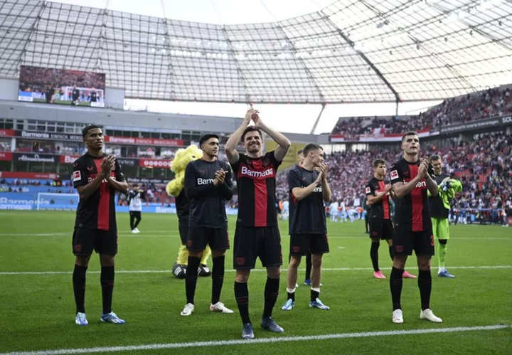 Soccer-Leverkusen move top of Bundesliga with 3-0 win over Cologne