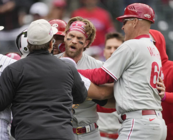 Harper ejected for charging dugout, Freeland pitches Rockies past Phillies 4-0 on 30th birthday