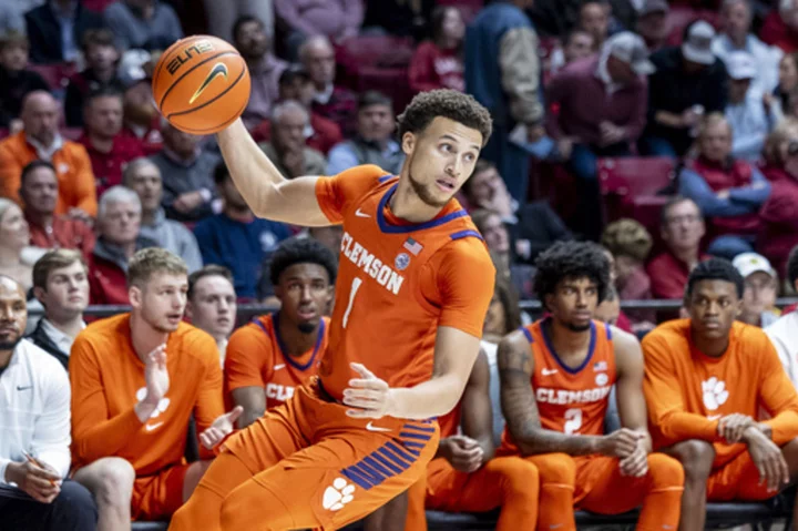 Hall's big game helps unbeaten Clemson win 85-77 at No. 23 Alabama in ACC/SEC Challenge