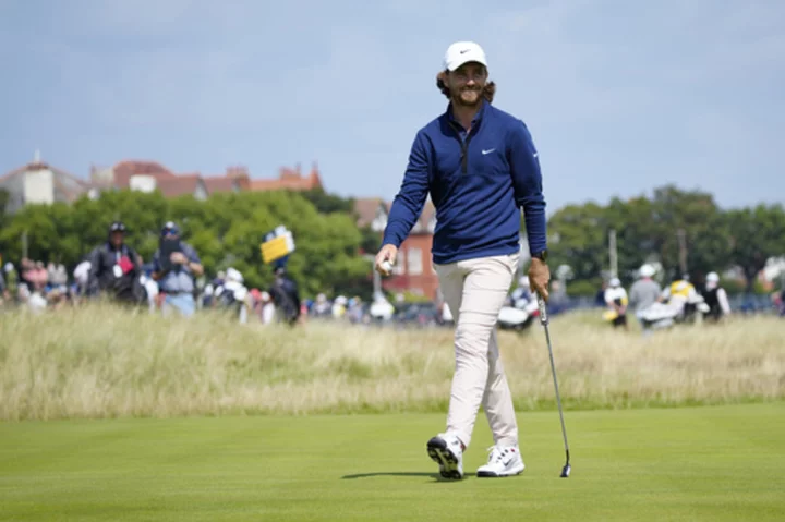 Crowd favorite Tommy Fleetwood shares the British Open lead. Rory McIlroy is among the survivors