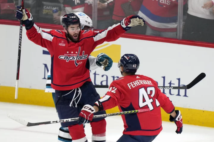 Wilson helps Capitals rally late to hand Sharks 9th straight loss to open season