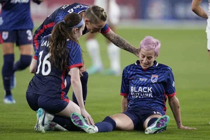 Megan Rapinoe hobbles off the pitch after injury early in the final match of her career