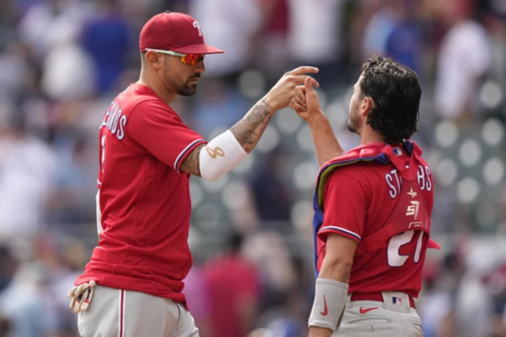 Castellanos hits 2 homers, makes pivotal throw for an out, as Phillies beat Braves 6-5 in 10