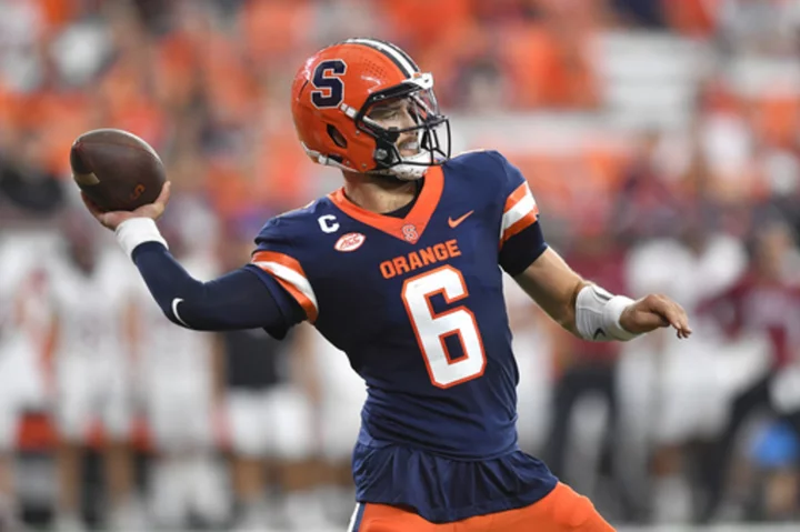 Garrett Shrader passes for four touchdowns in Syracuse's 65-0 rout of Colgate in season opener.