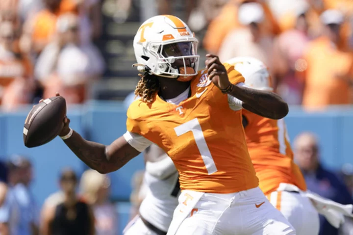 Milton throws 2 TD passes and runs for 2 other scores as No. 12 Tennessee routs Virginia 49-13