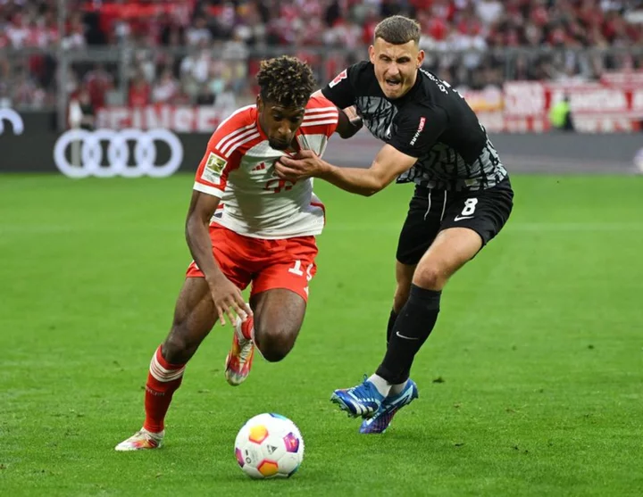 Soccer-Coman double leads Bayern to 3-0 win over Freiburg