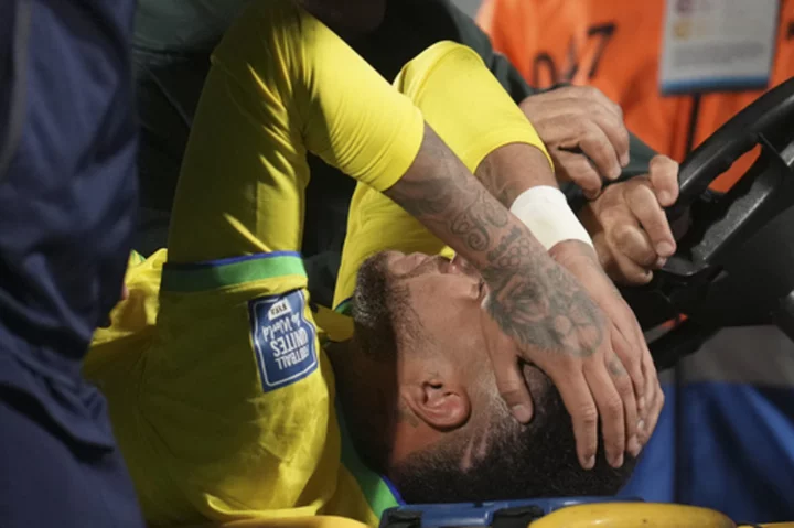 Neymar leaves Brazil match in tears with apparent left knee injury