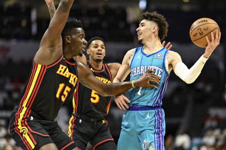 PJ Washington scores 25, rookie Brandon Miller provides spark as Hornets top Hawks 116-110 in opener