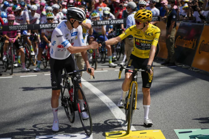 Pogacar hits the ground during Stage 17 of the Tour de France, but he gets back on his bike