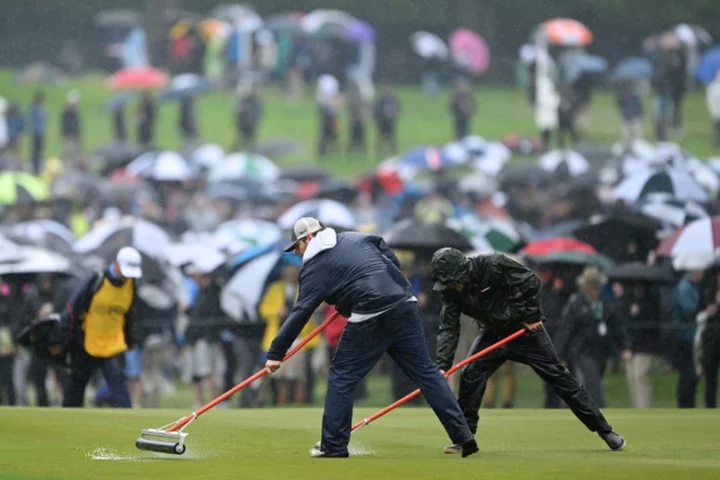 PGA leaders launch third round at rain-soaked Oak Hill