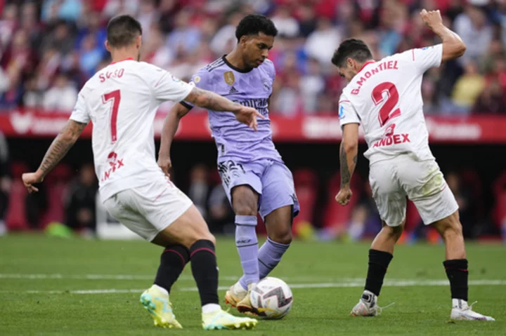 With Vinicius Junior out, Rodrygo scores 2 to lead Real Madrid to win at Sevilla