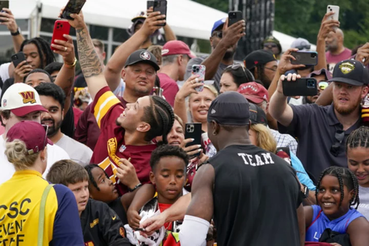 Fans return to Washington Commanders camp to celebrate the team's ownership change
