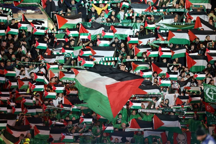 Celtic fans wave Palestinian flags ahead of Champions League fixture in defiance of club appeal