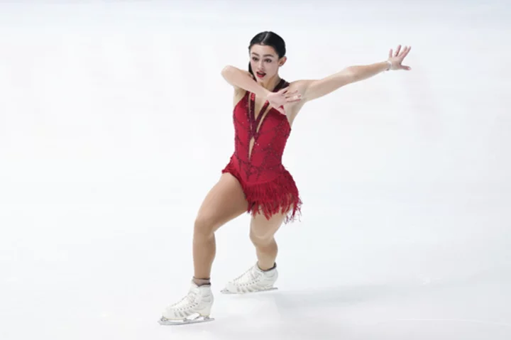Ziegler surges from fifth to first with a near-flawless free skate to win the NHK Trophy