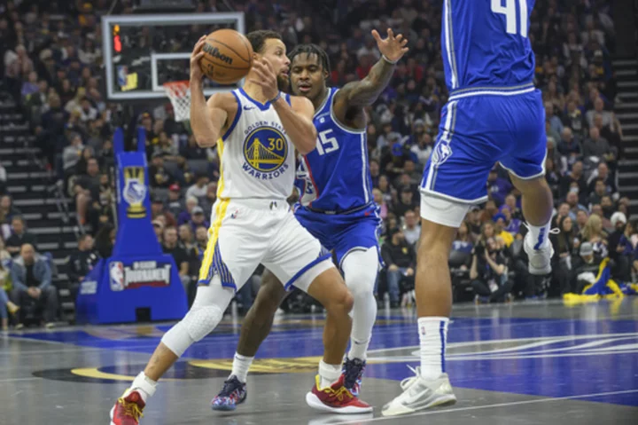 Monk's late basket leads the Kings past the Warriors 124-123 to win In-Season Tournament group