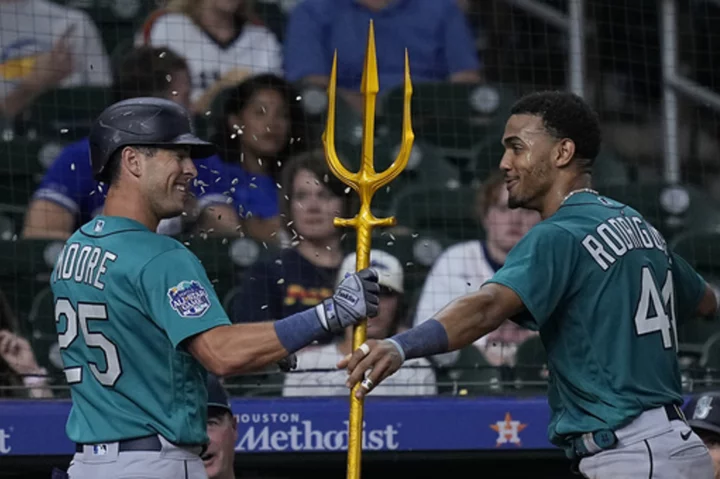 Moore homers twice and Rodriguez sets hits record as Mariners rout Astros 10-3
