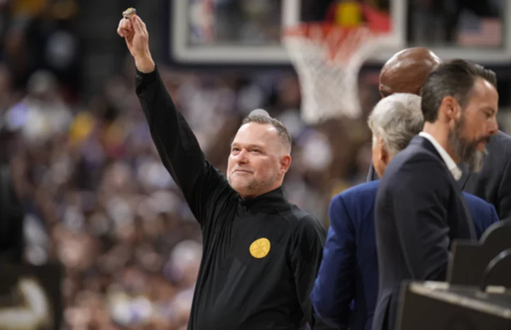 Jokic and the Nuggets receive rings, watch championship banner raised before tipping off season