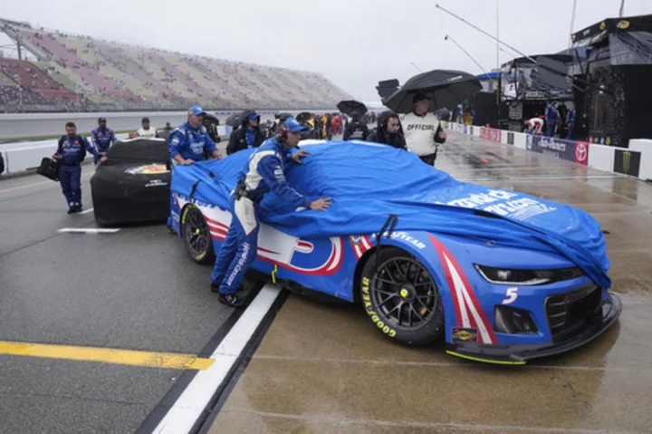 NASCAR suspends race at Michigan due to rain and aims to resume Monday