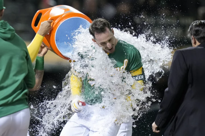A's rally for 4 in 10th, beat Rangers 9-7 on Rooker's 3-run homer