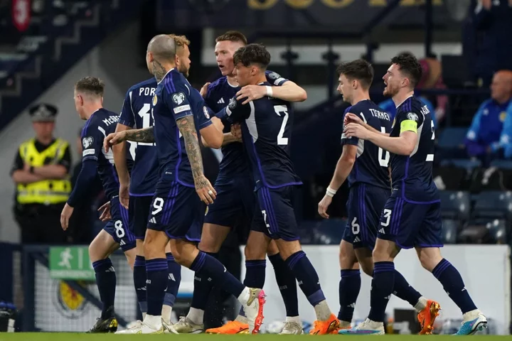 Scotland beat Georgia – and the weather – to move eight points clear in Group A