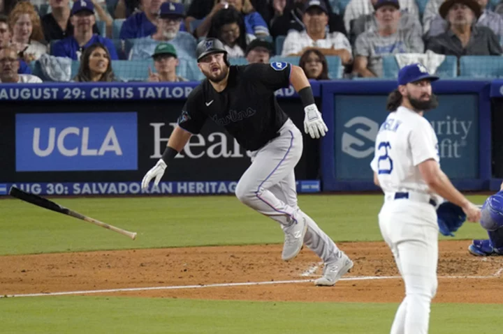 The Marlins slug 5 homers and snap the Dodgers' 11-game winning streak with an 11-3 victory