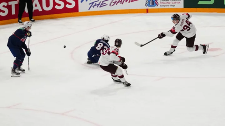 Latvia defeats US 4-3 in OT to win bronze at ice hockey worlds