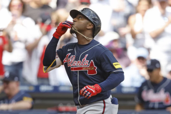 Albies' 3-run homer in the 8th gives the Braves a 4-2 victory over the Brewers