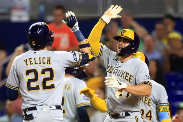 Brewers ride 12-run inning to victory, punch MLB playoff ticket