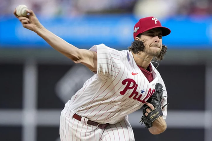 Aaron Nola returns to Phillies on 7-year deal, AP source says