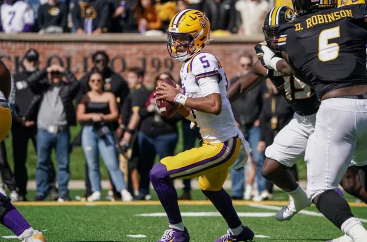 Jayden Daniels injury update: LSU QB leaves after uncalled late hit, returns soon after