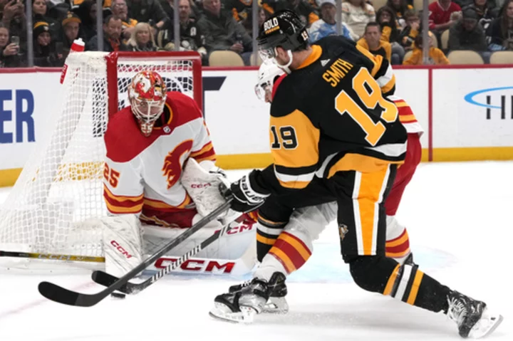 Malkin, Penguins surge past Flames with 5 goals in the third period for a 5-2 win