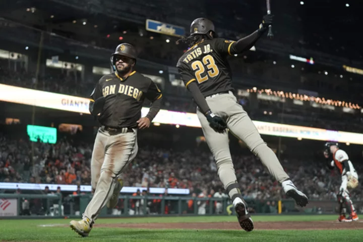 Padres keep playoff hopes alive, beat Giants 5-2 in 10th for first extra-inning win