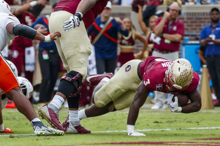 No. 4 Florida State beats Miami 27-20 to win its 16th straight and remain on track for CFP