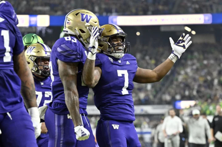 No. 3 Washington rallies to beat No. 5 Oregon 34-31 and secure playoff spot