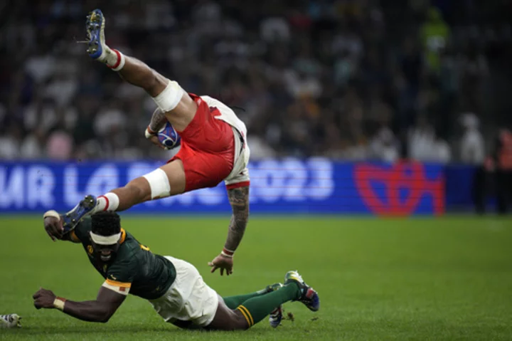 AP PHOTOS: Rugby World Cup quarterfinal race goes down to the wire for 6 of the 8 places