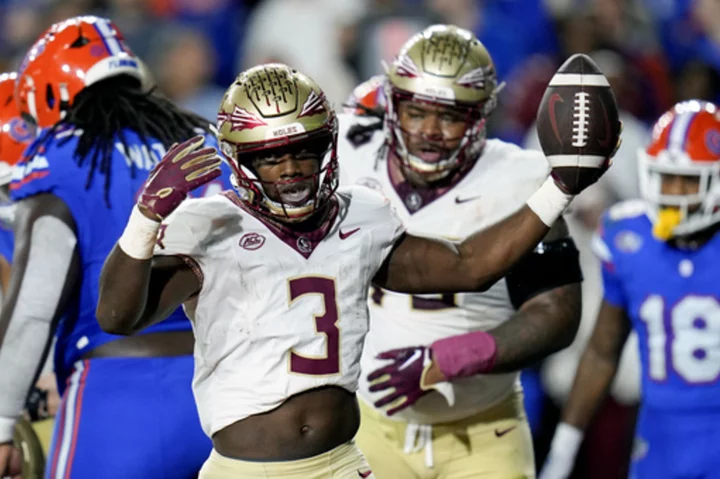 Benson scores 3 times, No. 5 Florida State beats rival Florida 24-15 for 18th consecutive win