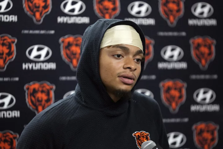 Justin Fields runs for 104 yards and passes for 169 in his return. Bears lose to Lions 31-26