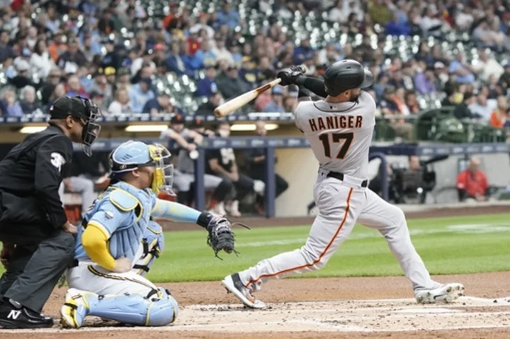 Giants win 15-1 to climb above .500; Brewers' Adames hit by foul ball while in dugout