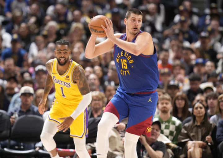 Jokic has 29 points, 13 rebounds, 11 assists as Nuggets get championship rings, season-opening win