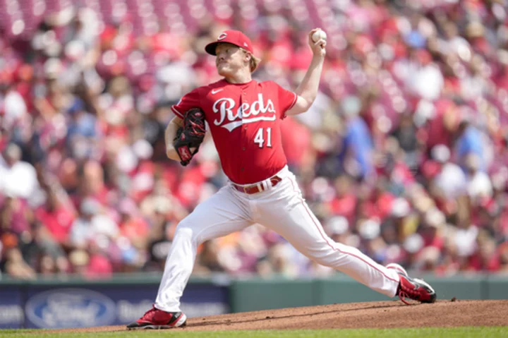 Abbott combines with Law on 2-hitter, Reds beat Giants 5-1 for 4-game split