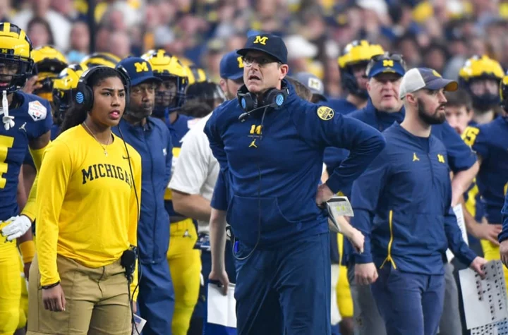 When does Michigan coach Jim Harbaugh return from suspension?