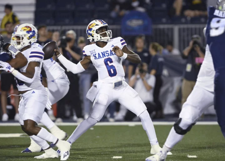 Neal runs for 3TDs, Hinshaw Jr. adds another to help Kansas beat Nevada 31-24