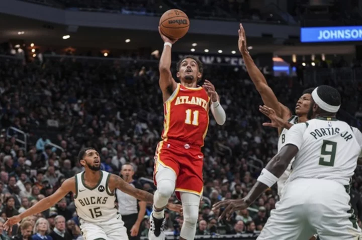 Hawks use balanced scoring, hold Lillard to six points and cruise past Bucks 127-110 for first win