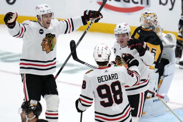 Bedard has assist in NHL debut, Blackhawks beat Crosby, Penguins 4-2 on opening night