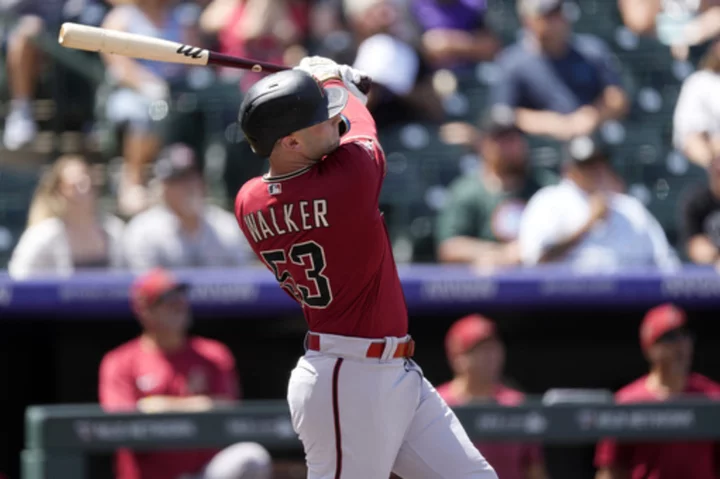 Walker homers twice, hitting 2-run shot in 8th in Diamondbacks' 9-7 victory over Rockies