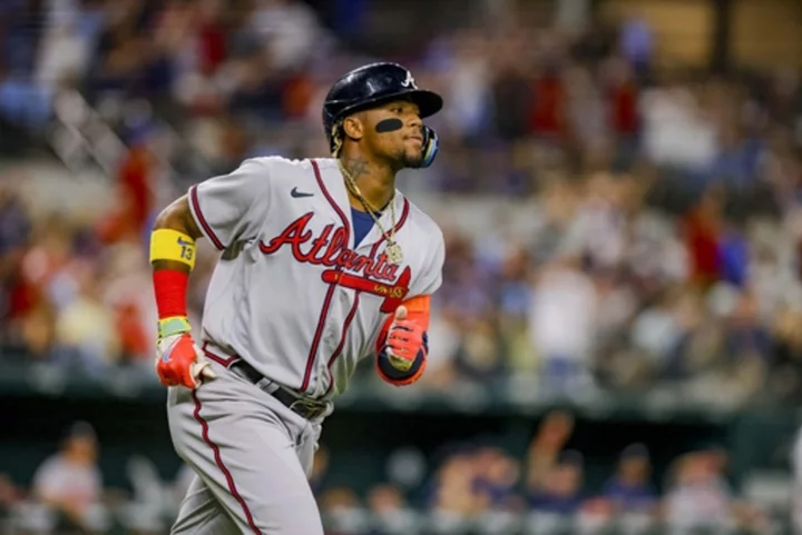 Braves blast five 2-run HRs to rout Rangers 12-0 in matchup of 1st-place teams