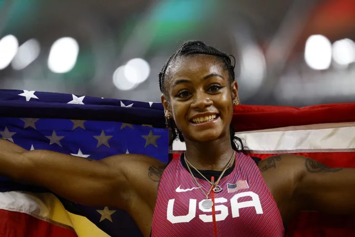 Athletics-American Richardson claims world gold in women's 100m