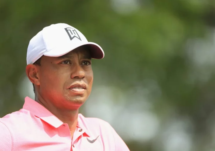 Tiger Woods appears fit for return after caddie role for son