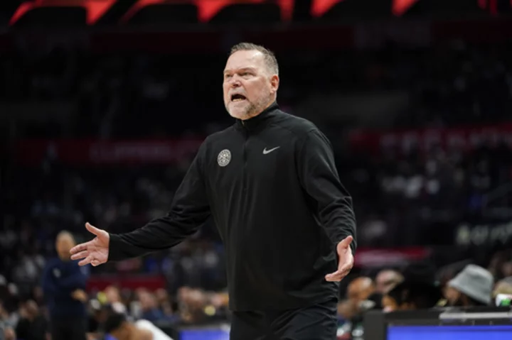 Nuggets coach Michael Malone remembers father on the eve of raising the championship banner