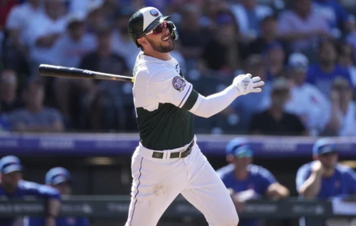 Kris Bryant hits one of the Rockies' four homers in a 7-3 win over the playoff-contending Cubs